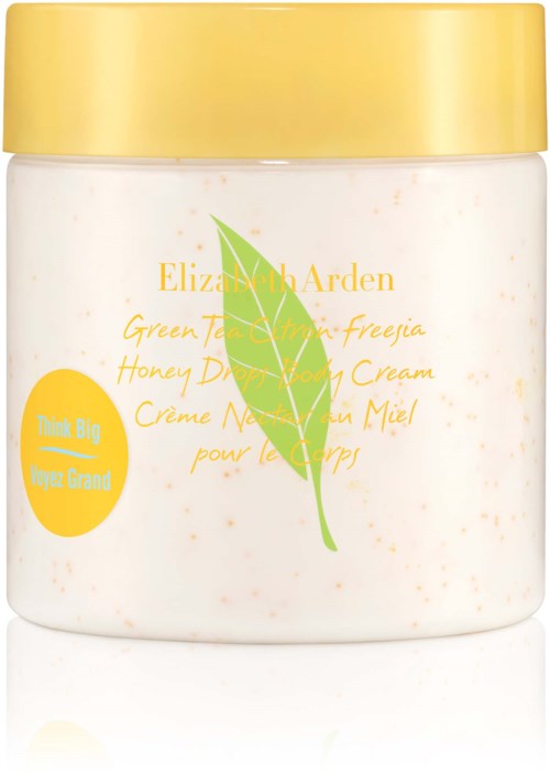 A white jar with a yellow lid, label has green leaf and yellow text, product appears to be a cream.