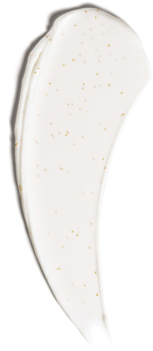 A white, curved cosmetic or skincare product with tiny golden specks on it.