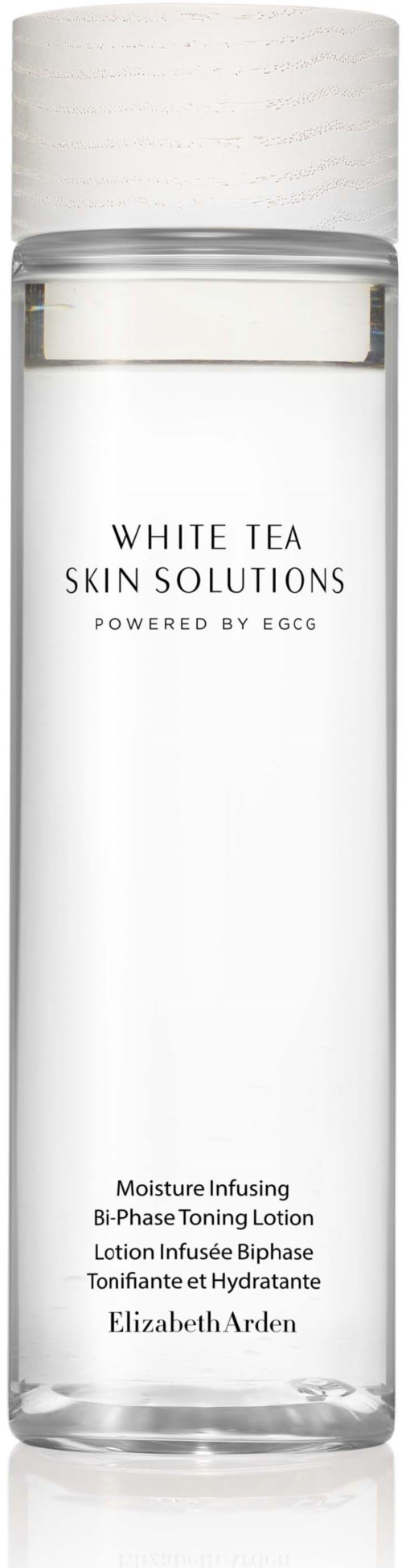 A clear bottle labeled 'White Tea Skin Solutions' with a white cap, contains a skincare lotion. Made by Elizabeth Arden.