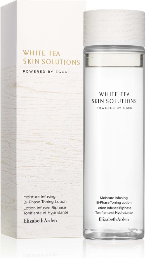 A clear bottle of skin toning lotion next to its white box packaging with text describing the product details.