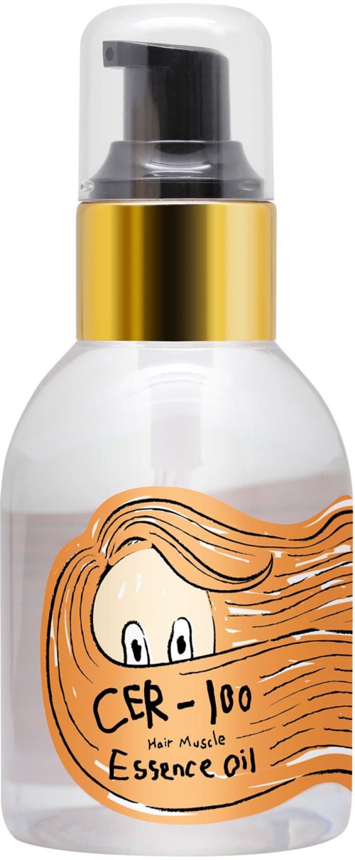 Een doorzichtige sprayfles met een zwarte pump, gouden band en een label met een tekening van haar en tekst.