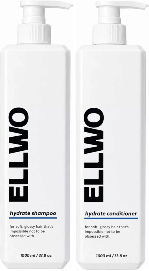 Two tall white bottles with pump dispensers, labeled OMILLO hydrate shampoo and hydrate conditioner, for soft, glossy hair.