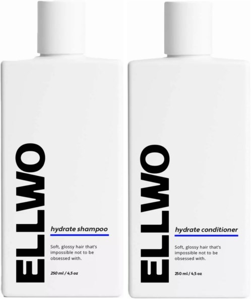 Two white bottles of Ello hair care products, one for hydrate shampoo and one for hydrate conditioner, with black and blue text.