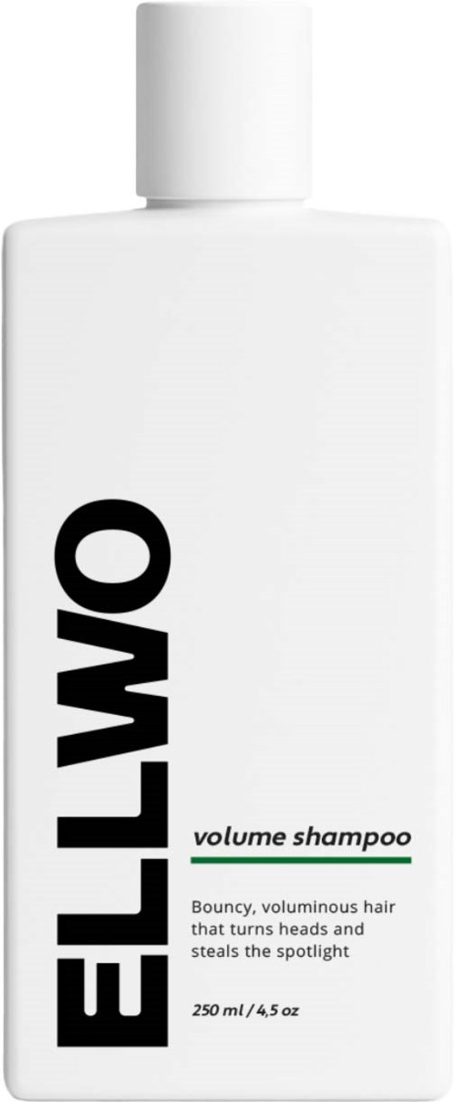 A white bottle of ELLO volume shampoo with black and green text, containing bouncy hair.