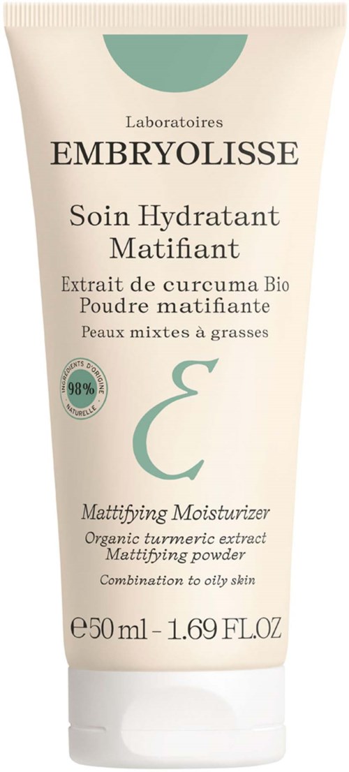 A cream tube with a label indicating it's for oily skin, containing organic turmeric extract, and is a mattifying moisturizer.
