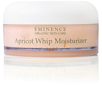 En liten burk med aprikos- och vitfärgad moisturizer från Éminence Organic Skin Care.