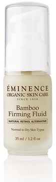 Valkoinen pullo pumppulla, etiketti ÉMIGENCE Bamboo Firming Fluid ihonhoitoon.