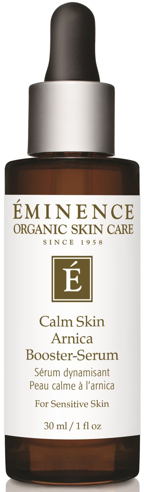 Ruskea lasipullo mustalla tipputulpalla, etiketti Éminence Calm Skin Arnica Booster-Serum herkälle iholle.