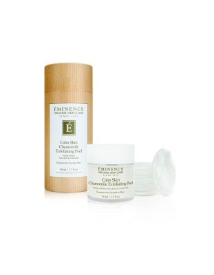 A skincare product with a wooden container and a white jar, both labeled "Eminence" and mentioning calming ingredients.