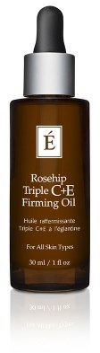A brown glass bottle with a dropper, labeled 'Rosehip Triple C+E Firming Oil' for all skin types.