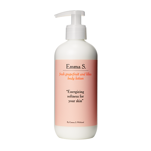 A white bottle with a pump, labeled as Emma S. body lotion with grapefruit scent and softening effect.
