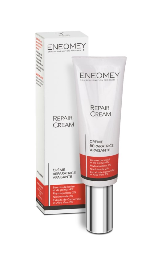 Een witte tube met herstellende crème met rood label, naast de doos, gemerkt ENEOMEY, bedoeld voor huidherstel.