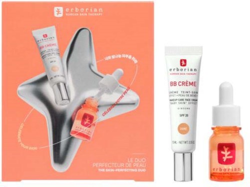 Skincare set with BB cream and facial oil on a coral background, packaged in a box with skincare product images.