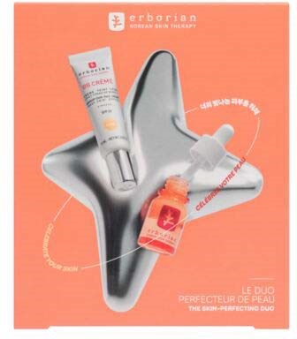 A skincare product tube and a small bottle with dropper on a star-shaped silver tray.
