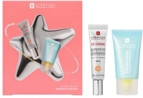 Two skincare products in tubes and a CC cream in a tube, displayed on a pink and silver star-shaped tray.
