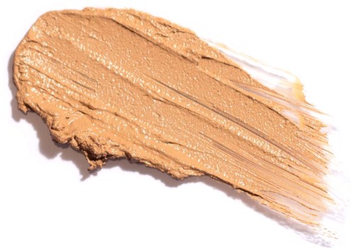 En smet av beigefärgad makeup med puderaktig textur och lite skimrande, utsprett på en vit bakgrund.
