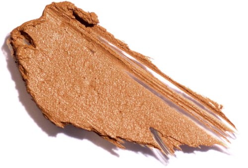 Ett stryk av ljusbrun makeup eller kräm på vitt papper med en randig textur.