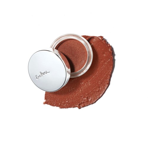 A small round container with brownish makeup inside, partially opened, on a white background.