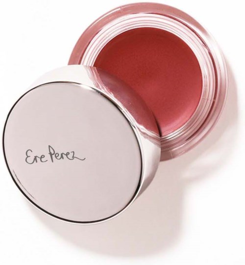 Ein kleiner runder Behälter mit rosa Creme darin, Deckel trägt die Aufschrift 'Ere Perez'.