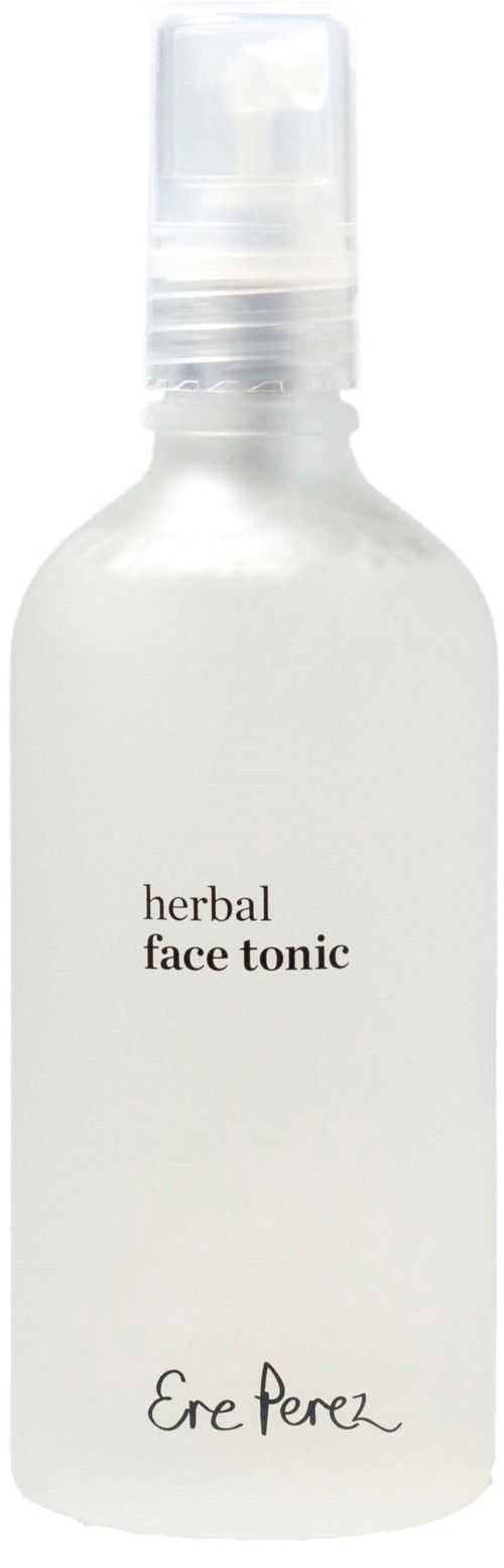 Een matte sprayfles met 'herbal face tonic' en de merknaam 'Ere Perez' onderaan.