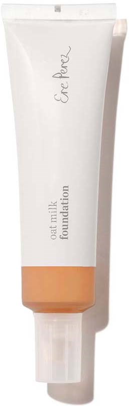 Een witte tube met een perzikkleurige dop en label, gemarkeerd "Oat Milk Foundation."