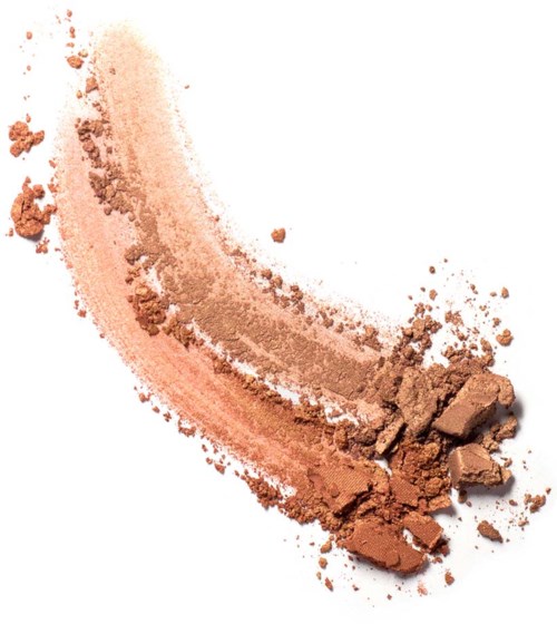 Een gebogen lijn van gebroken bruin en beige make-up poeder, met enkele grotere stukjes aan het einde.