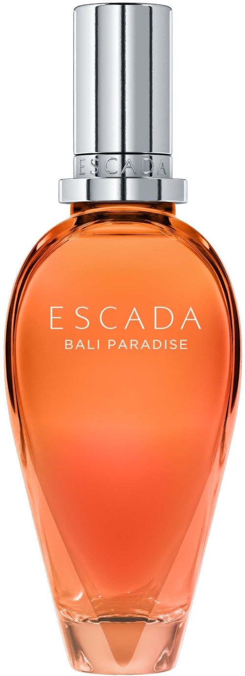 Een parfumfles met zilveren dop, oranje vloeistof en witte tekst die zegt 'ESCADA BALI PARADISE.'