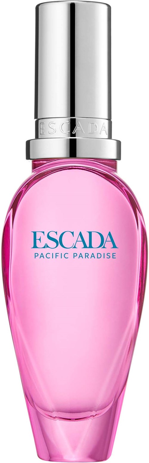Een roze parfumfles met een zilveren dop en blauwe tekst die Escada Pacific Paradise leest.