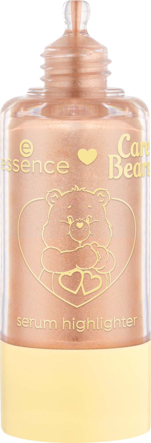 En rosa och gul flaska med serum highlighter som har en björnlogga och guldtext på fronten.
