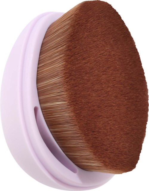 A makeup applying tool with soft brown bristles and a light purple handle.