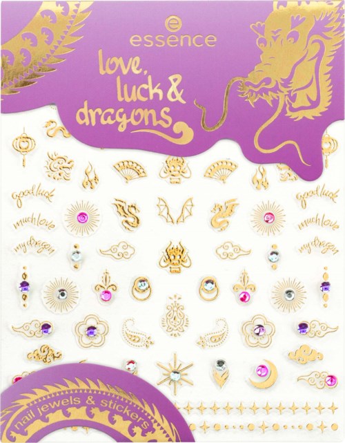Värikäs koru- ja tarra-kokoelma dragonit, rakkaus, onnea ja onnen symboleine violetilla taustalla.