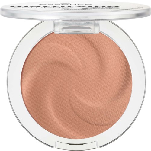 A round makeup compact with peach-colored pressed powder inside and a clear lid on top.