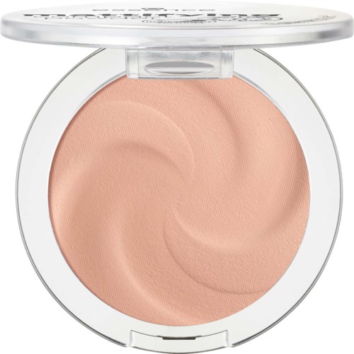 A round compact with peach-colored pressed powder and a clear lid, showing swirling pattern inside.