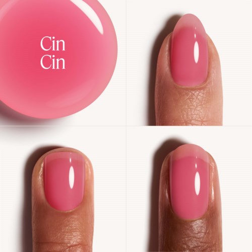 A nail polish bottle with pink color and four views of a painted fingernail. The label reads "Cin Cin".