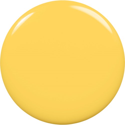 En stor, glänsande, gul boll med en liten vit reflekterande fläck på toppen.