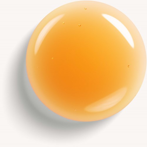 A round, orange-colored object with a shiny, smooth surface. It has small water droplets on it and casts a shadow.