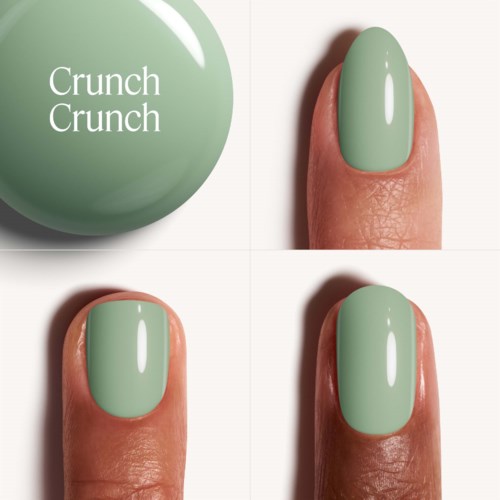 Green nail polish on a finger, with a round green ball labeled "Crunch Crunch" nearby.