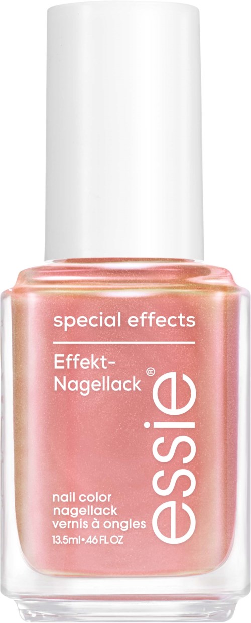 En flaska med Essie special effects nagellack i en persikfärgad rosa nyans.