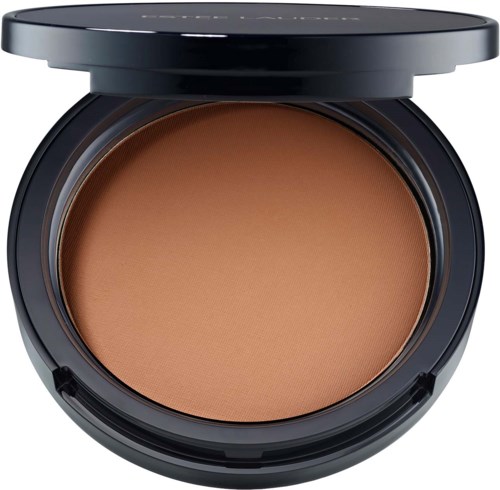 Cream blush in a round black compact, showing a warm peach shade inside.