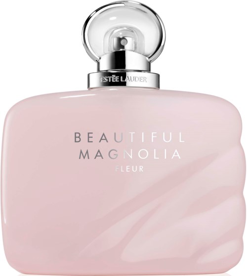 Een lichtroze parfumfles met een ronde, heldere dop en zilveren nek. Het label leest "BEAUTIFUL MAGNOLIA FLEUR."