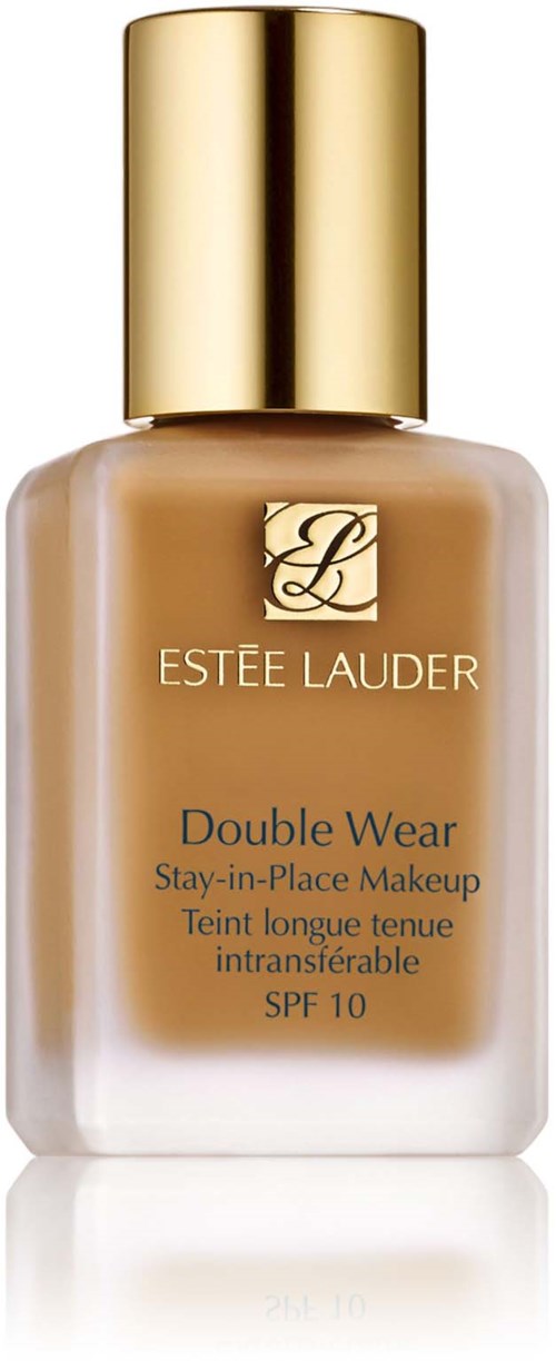 En flaska av Estée Lauder Double Wear foundation med guldkork och beige flytande inuti.