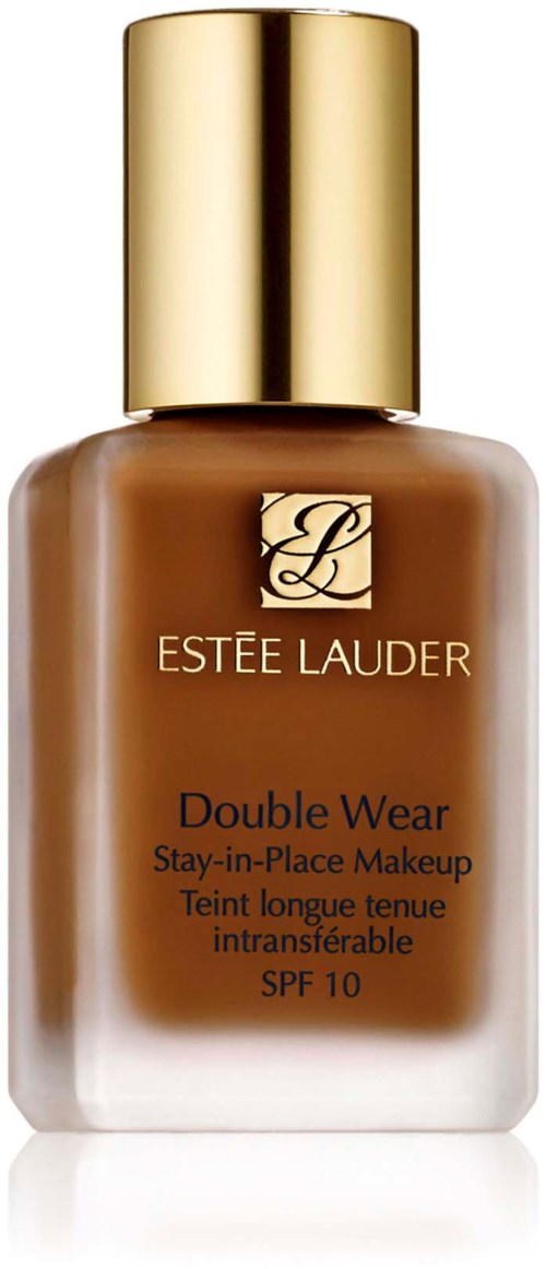 En flaska med Estee Lauder Double Wear foundation med guldkork, brunt vätska inuti, och märkesetikett.