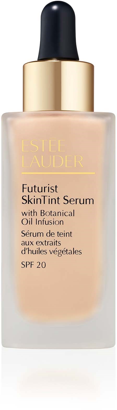 A bottle of Estée Lauder Futurist SkinTint Serum, with a dropper, contains beige liquid, and mentions botanical oils and SPF 20.