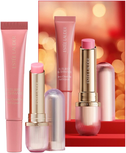 Estée Lauder skincare and makeup products in pink and gold packaging, displayed on a red platform with a bokeh background.