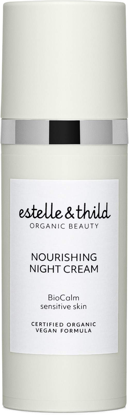 Eine weiße Flasche mit Silberband, beschriftet 'estelle & thild' nährende Nachtcreme für empfindliche Haut.