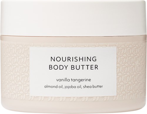 Nourishing body butter in a white jar with a beige core, labeled vanilla tangerine with ingredients almond oil, jojoba oil, and shea butter.