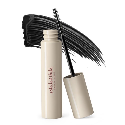 A beige eyelash mascara tube with a black brush, black mascara spread on a white background.