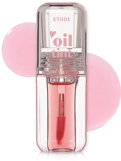 A lipstick tube with pink oil tint, clear casing, and a pink background, branded Etude.
