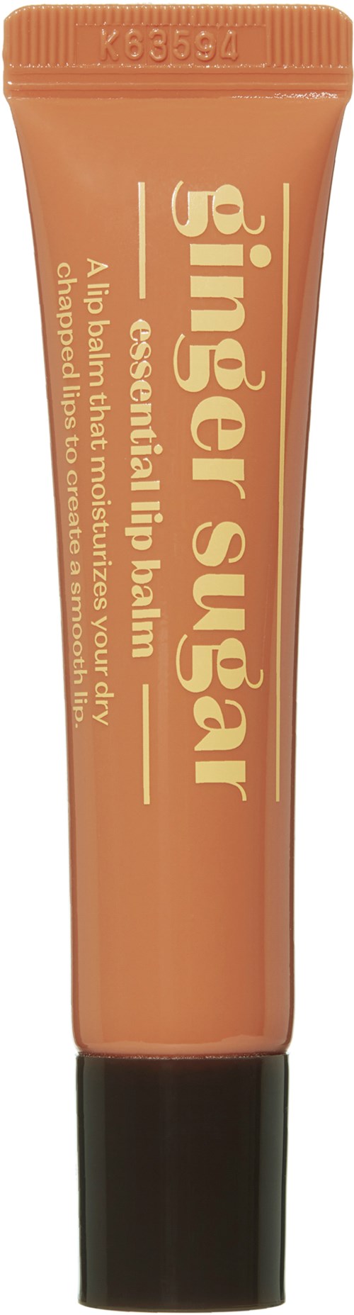 Een tube Ginger Sugar lippenbalsem, beschreven als essentieel voor gezonde lippen, met zwarte dop.