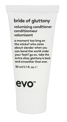 Eine kleine weiße Tube mit der Aufschrift 'Evo' enthält Volumen- und Glanzconditioner für Haare.